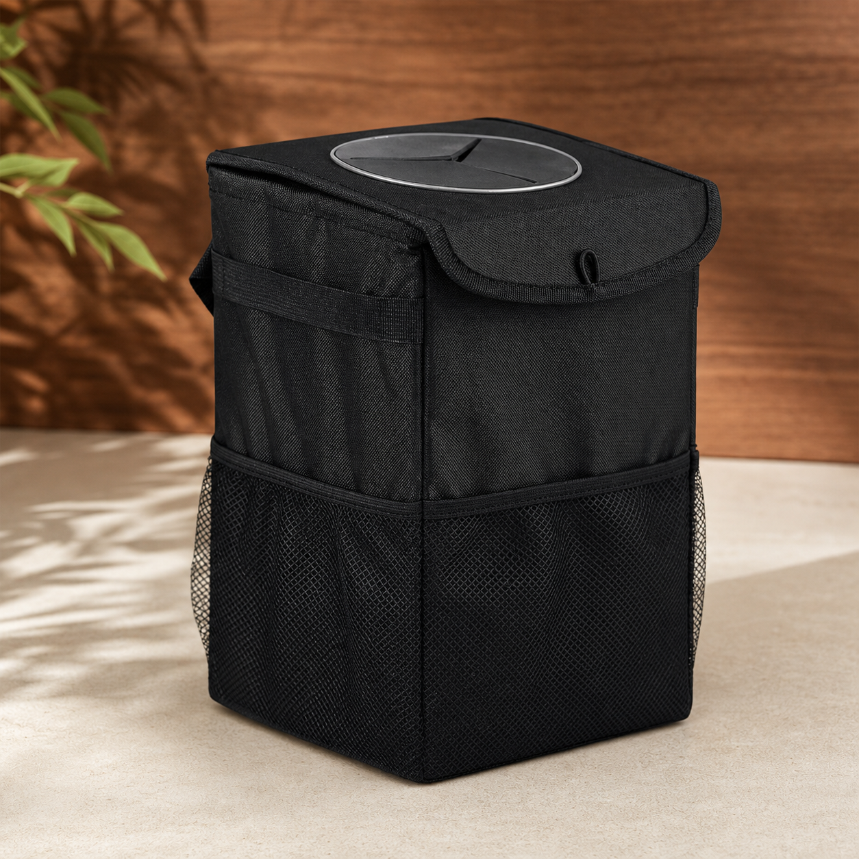 Black Oxford-cloth road bin shown upright in a warm studio setting