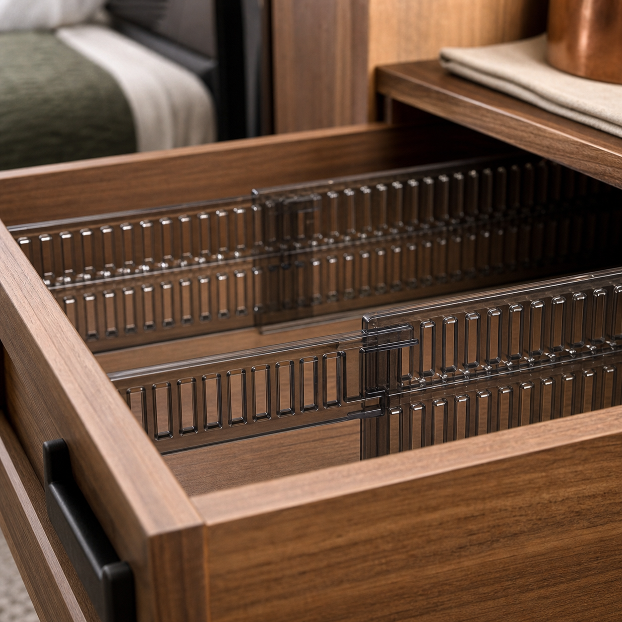 Close detail of the sliding joint on a smoky-black drawer divider