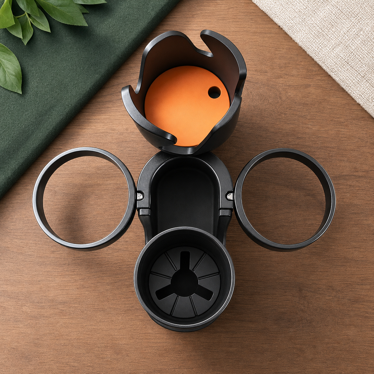 Top view of the black expandable cup station and its rotating layout