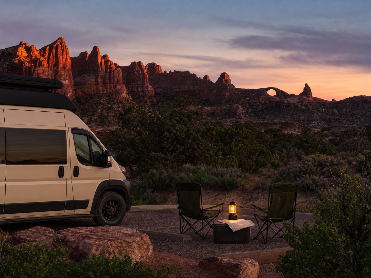 Camper van at a designated red-rock campground near Moab at sunset